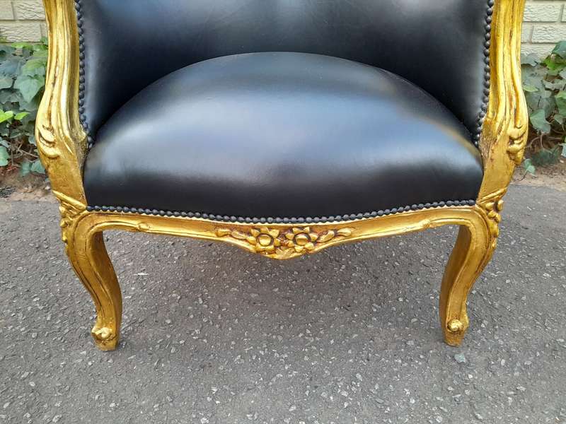 A 20th Century French Style Pair Of Carved Gilt Wood Armchairs
