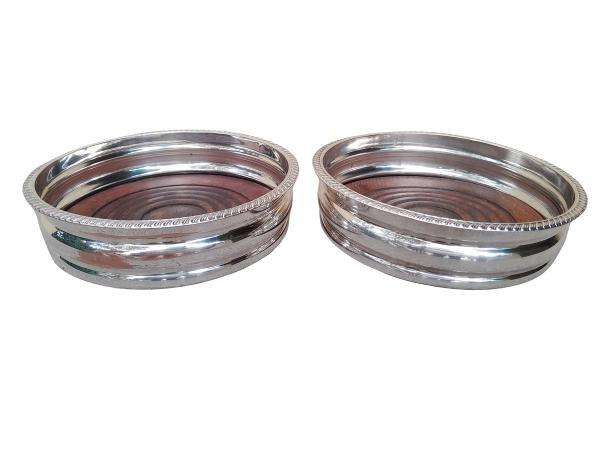An Early 20th Century Pair of Silver plated Wine Bottle Coasters with Wooden Bases