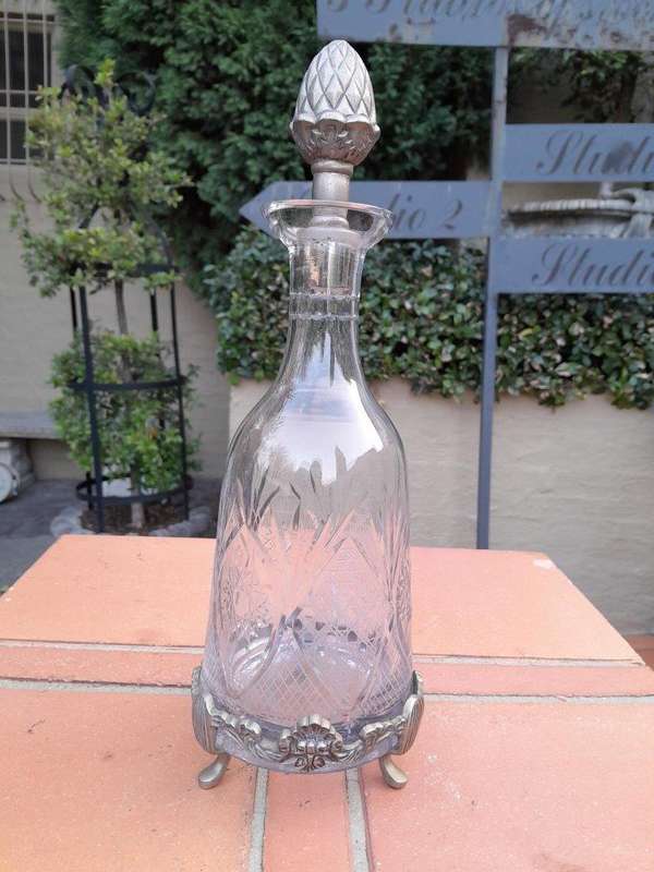 A 20TH Century  Cut Glass Decanter with Stopper on a Metal Base