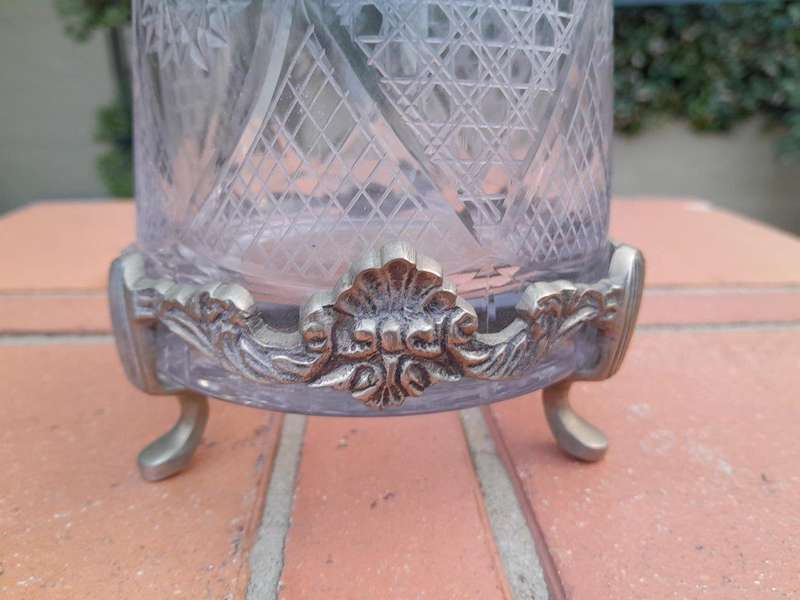 A 20TH Century  Cut Glass Decanter with Stopper on a Metal Base