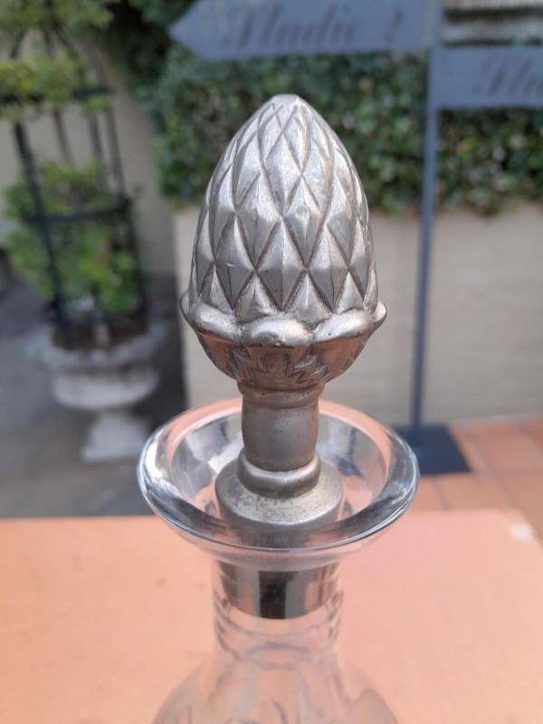 A 20TH Century  Cut Glass Decanter with Stopper on a Metal Base