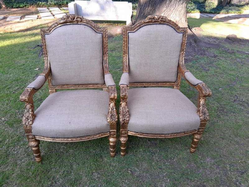 An Antique 19th Century French Pair of  Louis XV Style Heavily Carved Giltwood Armchairs