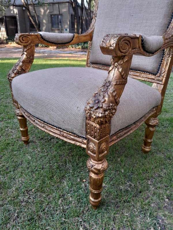 An Antique 19th Century French Pair of  Louis XV Style Heavily Carved Giltwood Armchairs