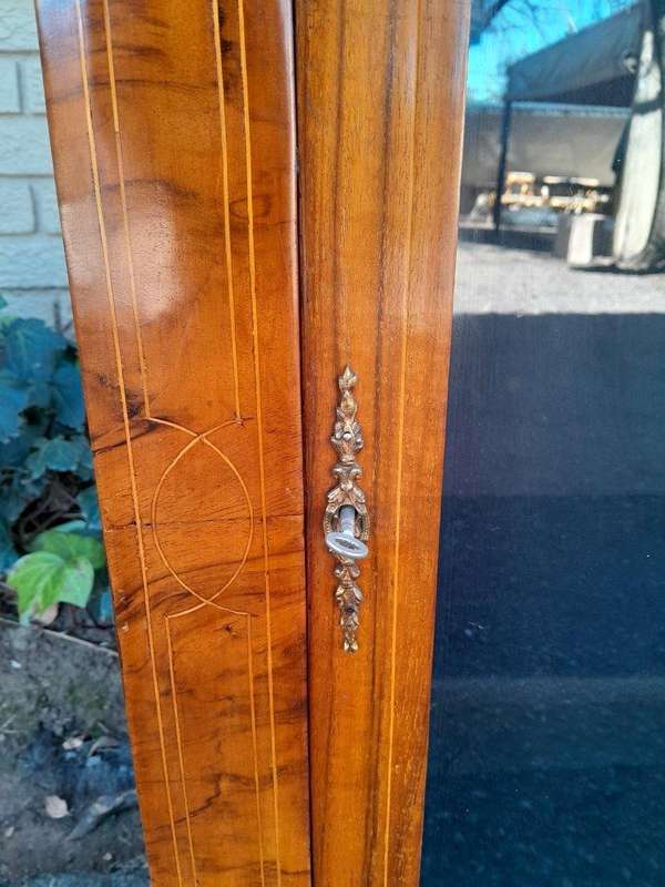 An Antique Victorian Walnut Cabinet with Metal Mounts and Glass Door