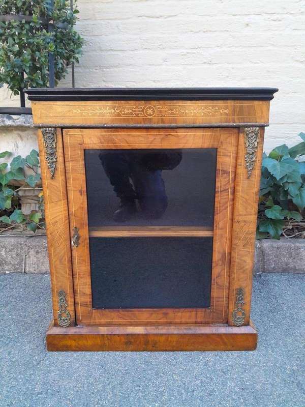 An Antique Victorian Walnut Cabinet with Metal Mounts and Glass Door