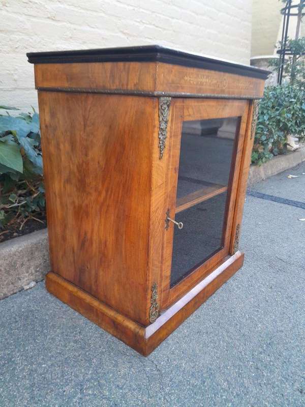 An Antique Victorian Walnut Cabinet with Metal Mounts and Glass Door