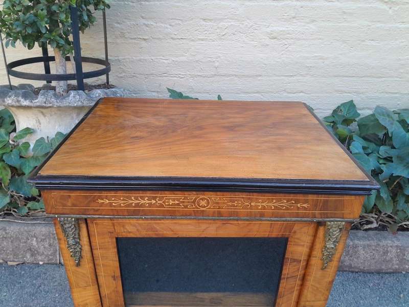 An Antique Victorian Walnut Cabinet with Metal Mounts and Glass Door