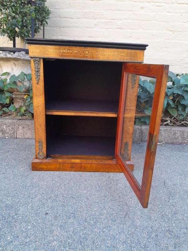An Antique Victorian Walnut Cabinet with Metal Mounts and Glass Door