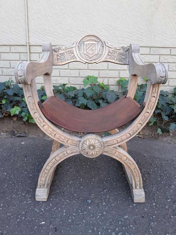 An Antique Early 20th Century Savonarola Carved Oak Chair with Leather Seat in a Contemporary Ble...