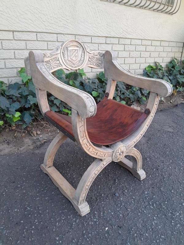 An Antique Early 20th Century Savonarola Carved Oak Chair with Leather Seat in a Contemporary Ble...