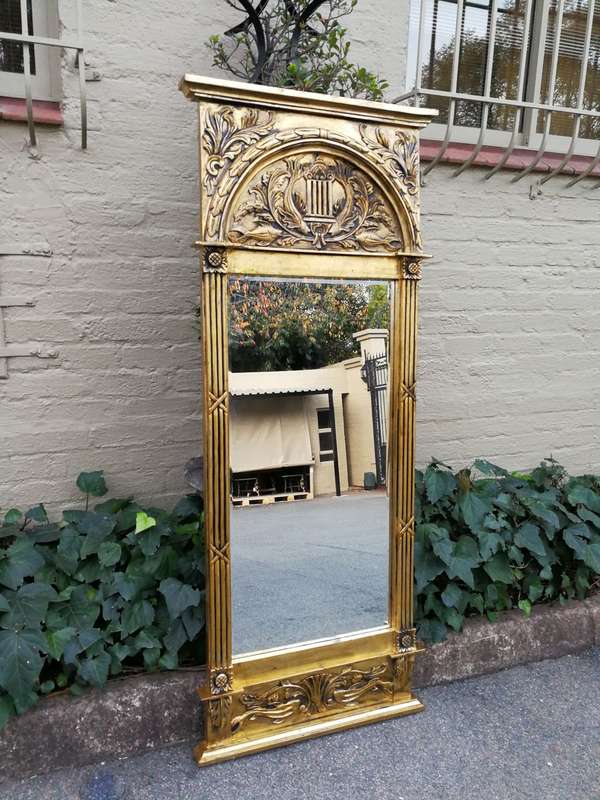 A 20th Century French Carved and Hand Gilded Bevelled Mirror