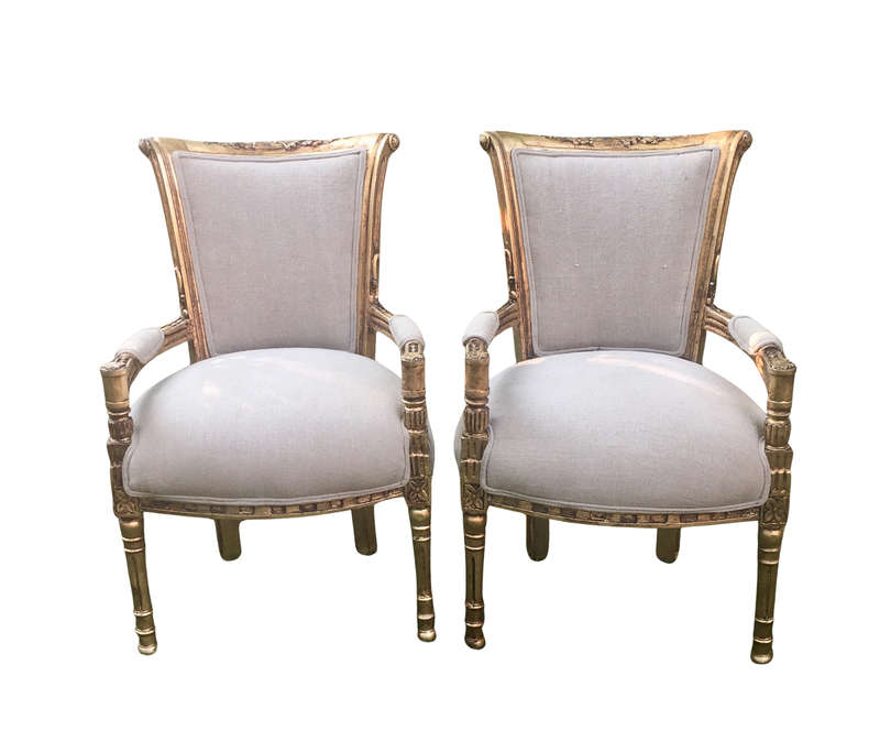 A Pair of French Style Arm Chairs, Hand-Gilded with Gold Leaf and Covered in an Imported Linen