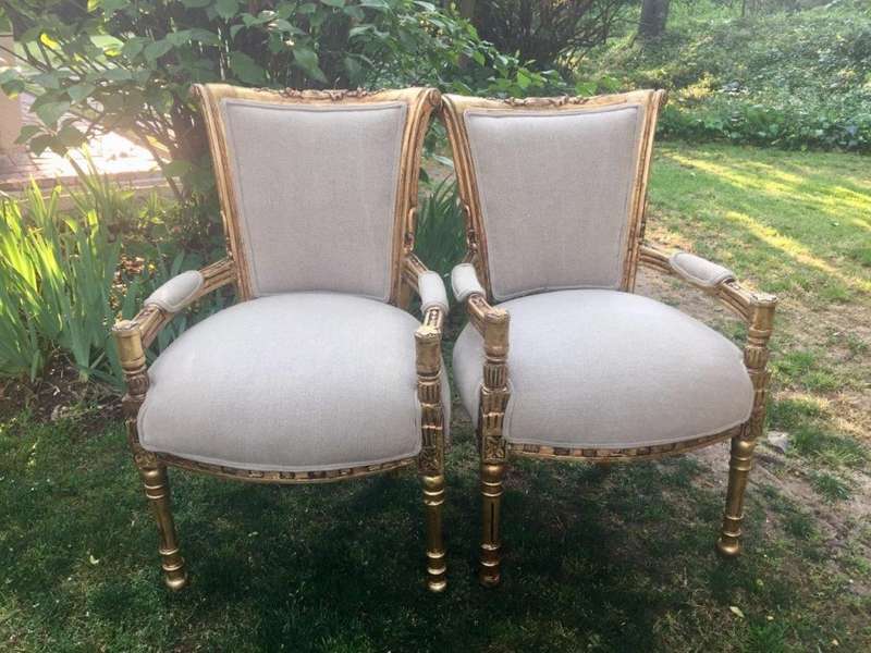 A Pair of French Style Arm Chairs, Hand-Gilded with Gold Leaf and Covered in an Imported Linen