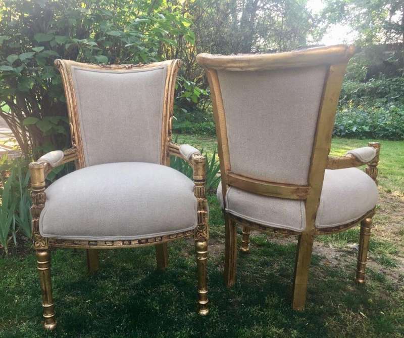 A Pair of French Style Arm Chairs, Hand-Gilded with Gold Leaf and Covered in an Imported Linen