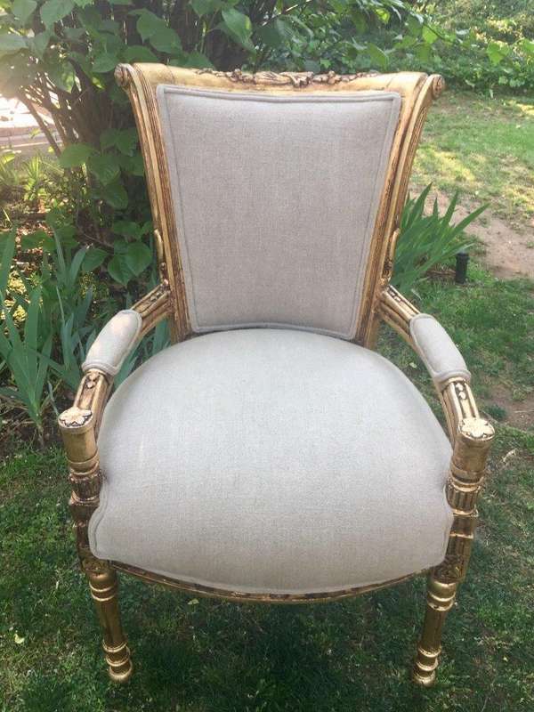 A Pair of French Style Arm Chairs, Hand-Gilded with Gold Leaf and Covered in an Imported Linen