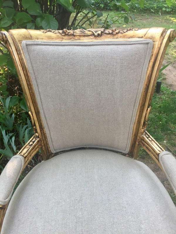 A Pair of French Style Arm Chairs, Hand-Gilded with Gold Leaf and Covered in an Imported Linen