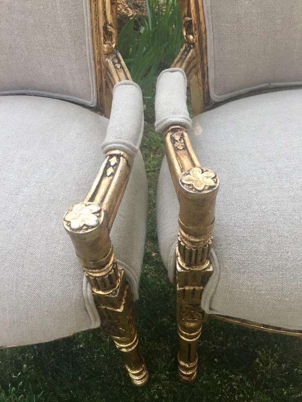 A Pair of French Style Arm Chairs, Hand-Gilded with Gold Leaf and Covered in an Imported Linen