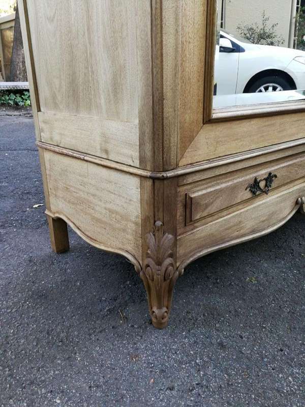 A 20th Century French Rococo Style Armoire with Bevelled Mirrors and Drawers finished in a contem...