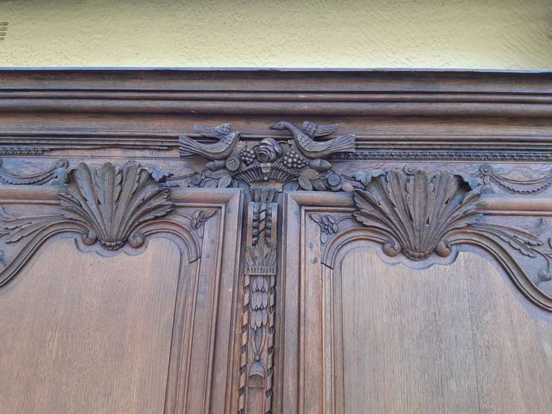A French Provincial styled Ornately carved Armoire