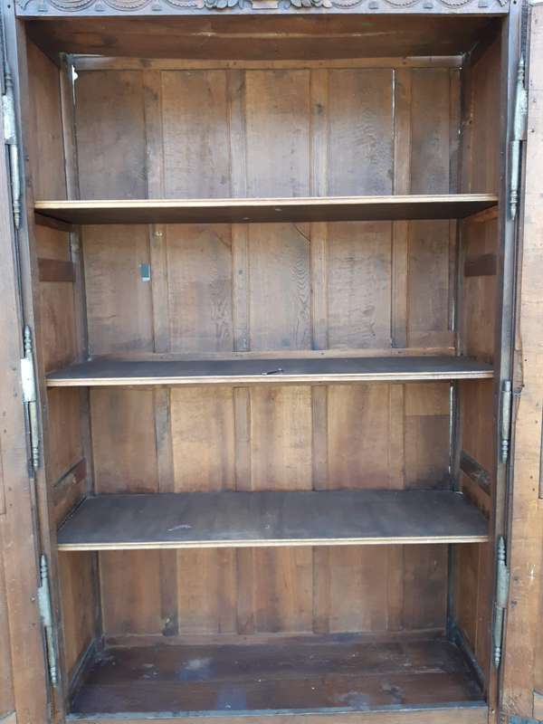 A French Provincial styled Ornately carved Armoire