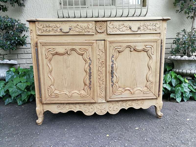 A Provincial Style French Oak Server in a Contemporary Bleached / Natural Wood Finish with Cream ...