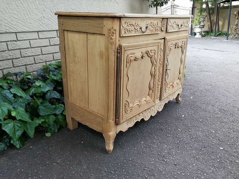 A Provincial Style French Oak Server in a Contemporary Bleached / Natural Wood Finish with Cream ...