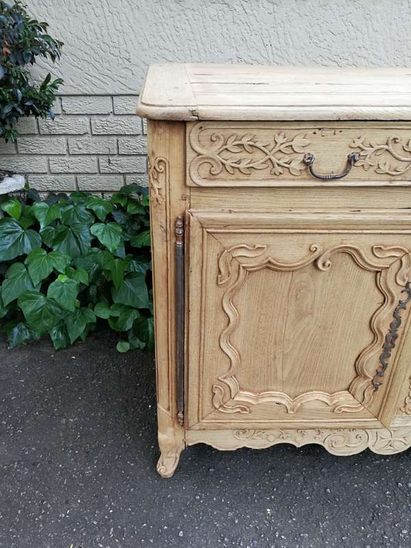 A Provincial Style French Oak Server in a Contemporary Bleached / Natural Wood Finish with Cream ...
