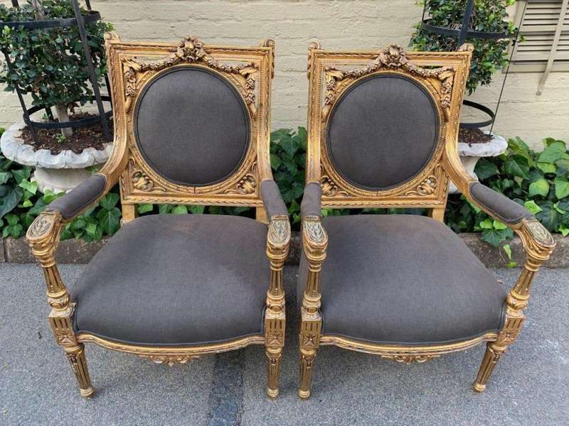 A 20th Century Pair (over 80 years old) of French Style Ornately Carved and Gilded Arm Chairs Uph...