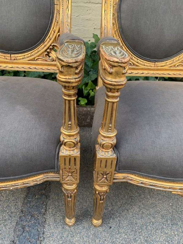 A 20th Century Pair (over 80 years old) of French Style Ornately Carved and Gilded Arm Chairs Uph...