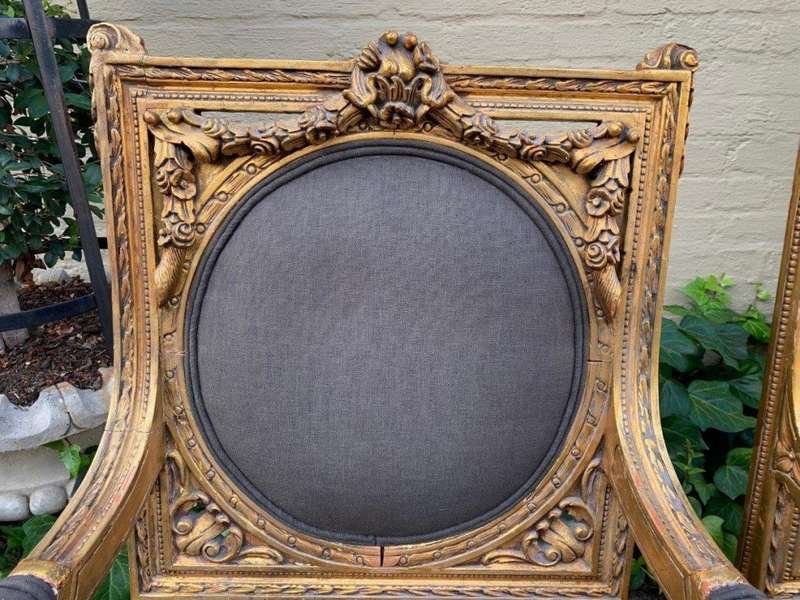 A 20th Century Pair (over 80 years old) of French Style Ornately Carved and Gilded Arm Chairs Uph...