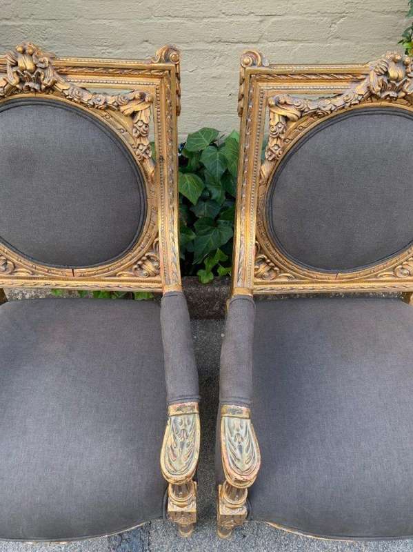 A 20th Century Pair (over 80 years old) of French Style Ornately Carved and Gilded Arm Chairs Uph...