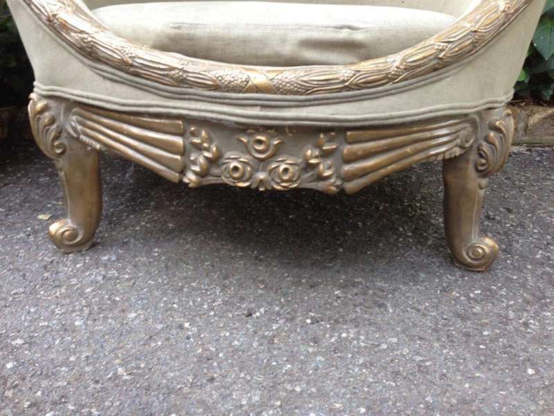 A Pair of French Empire Style Carved and Gilded Arm / Tub / Bergere Chairs Upholstered in an Impo...