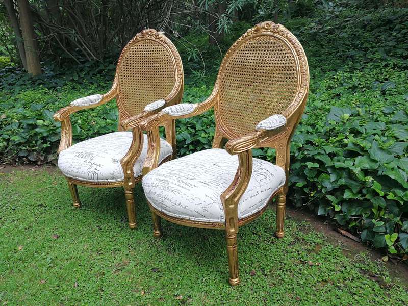 A Pair Of French Style Carved and Gilded Rattan Back Armchairs Upholstered in an Imported Fabric ...