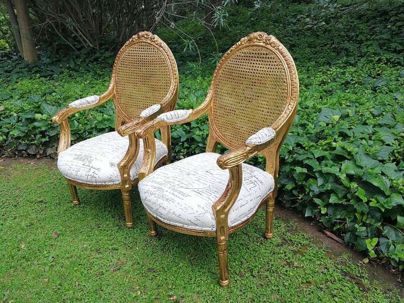 A Pair Of French Style Carved and Gilded Rattan Back Armchairs Upholstered in an Imported Fabric ...