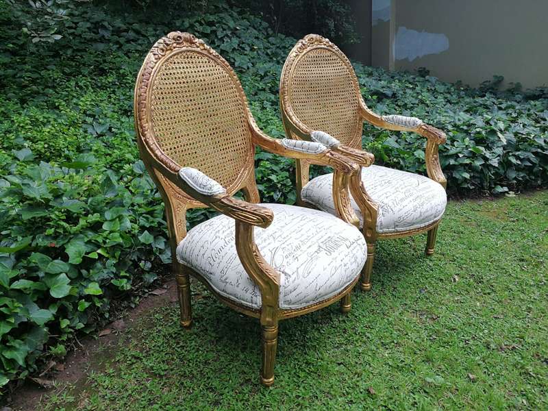 A Pair Of French Style Carved and Gilded Rattan Back Armchairs Upholstered in an Imported Fabric ...