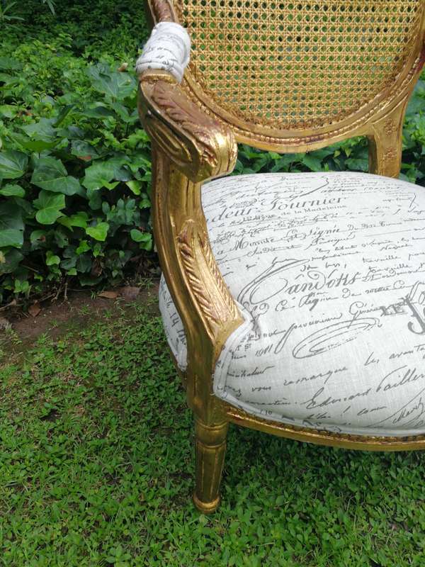 A Pair Of French Style Carved and Gilded Rattan Back Armchairs Upholstered in an Imported Fabric ...