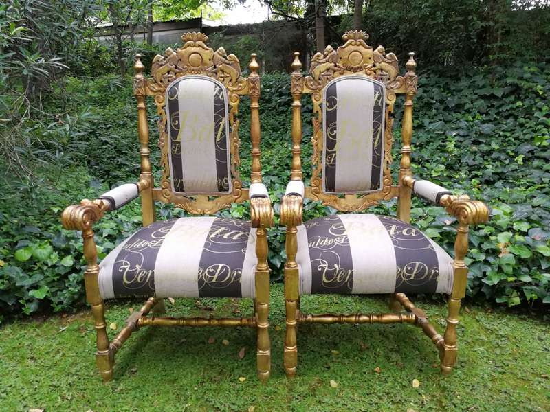 Pair of 19th Century carved teak and gilded in gold leaf open arm throne chairs         ...