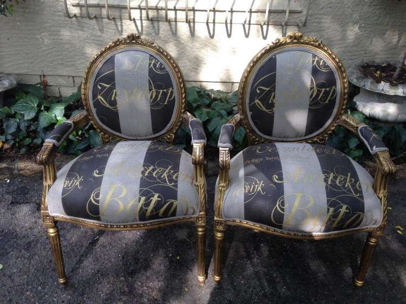 A Pair of French Style Arm Chairs Hand Gilded With Gold Leaf And Upholstered In an Imported Scrip...
