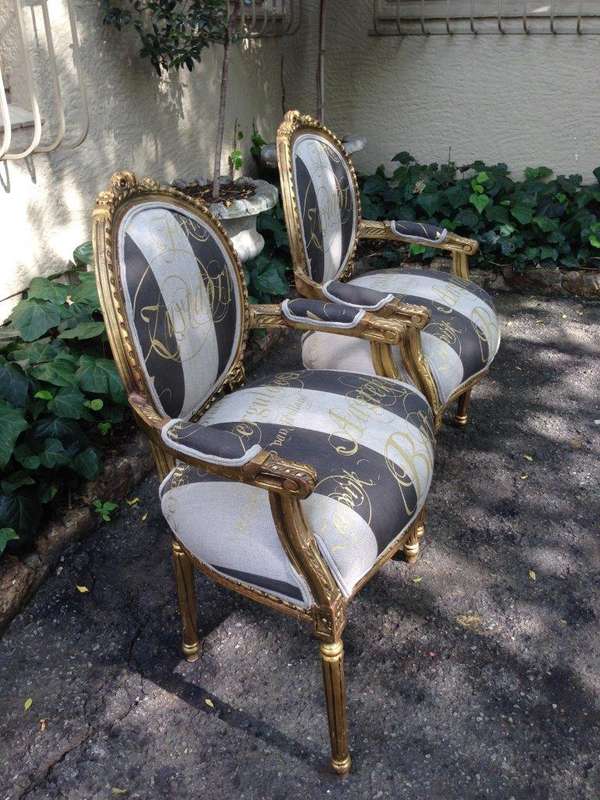 A Pair of French Style Arm Chairs Hand Gilded With Gold Leaf And Upholstered In an Imported Scrip...