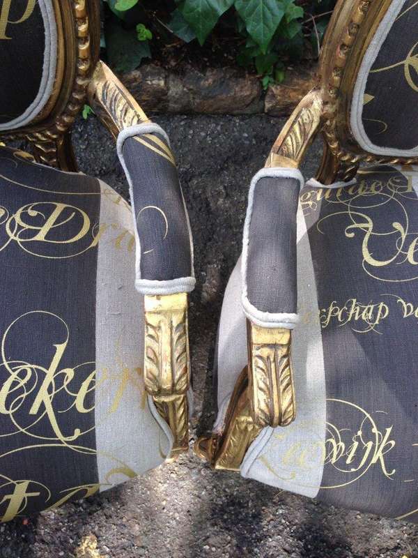 A Pair of French Style Arm Chairs Hand Gilded With Gold Leaf And Upholstered In an Imported Scrip...