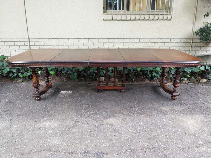 Renaissance Henry II dining table with carved and turned legs and a middle stretcher. Late 19th c...