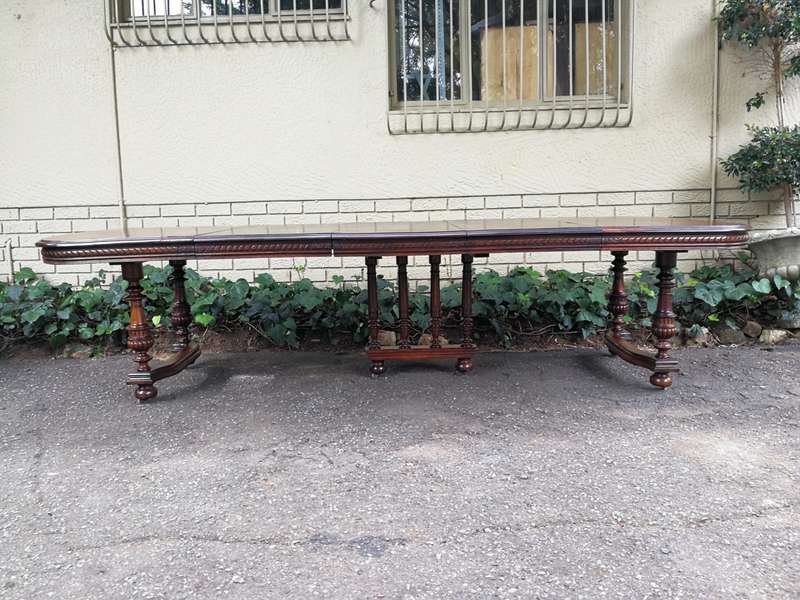 Renaissance Henry II dining table with carved and turned legs and a middle stretcher. Late 19th c...