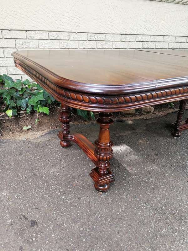 Renaissance Henry II dining table with carved and turned legs and a middle stretcher. Late 19th c...