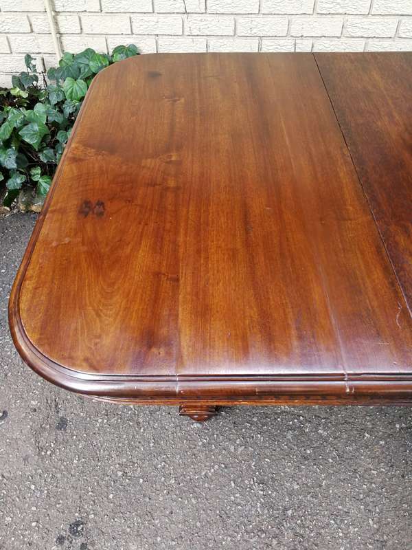 Renaissance Henry II dining table with carved and turned legs and a middle stretcher. Late 19th c...