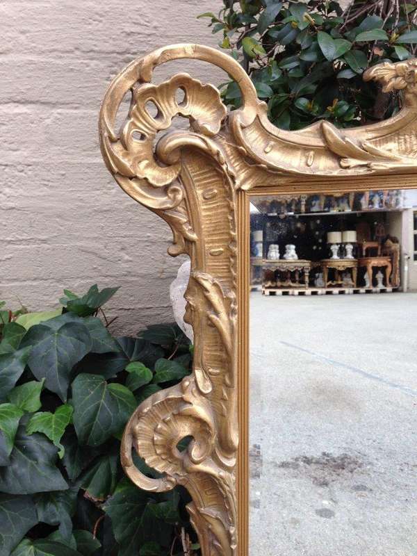 A Gilt Rococo-Style Frame With Bevelled Mirror Plate