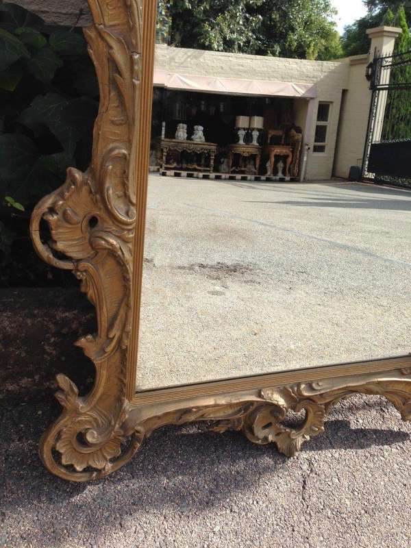 A Gilt Rococo-Style Frame With Bevelled Mirror Plate