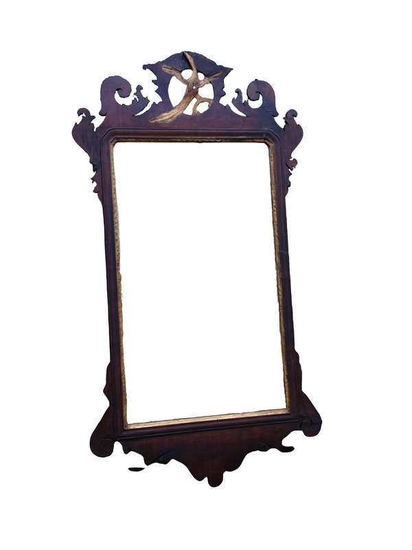 A Georgian mahogany mirror with an eagle