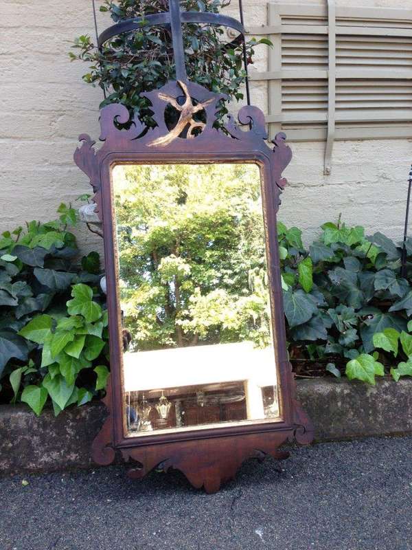 A Georgian mahogany mirror with an eagle
