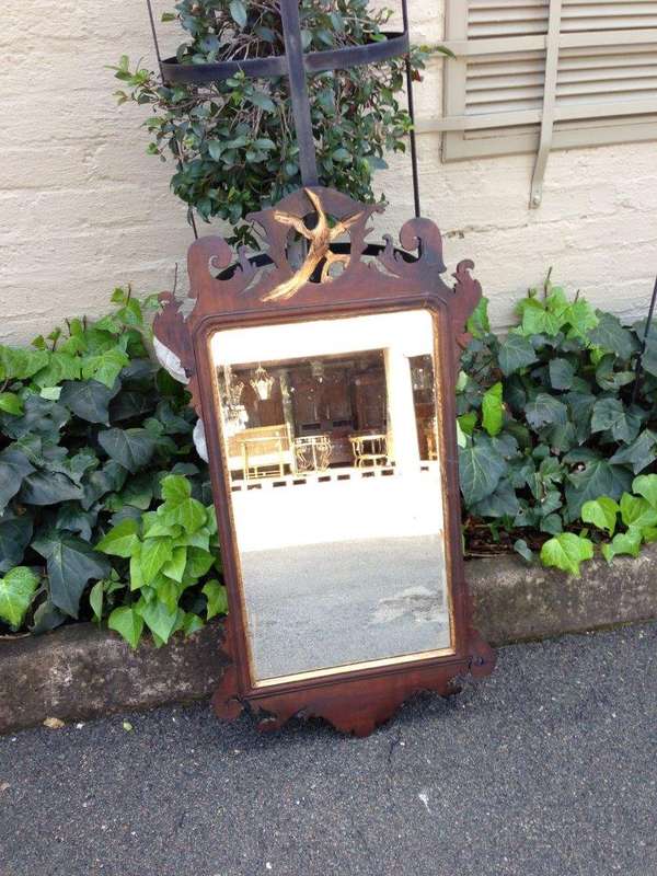 A Georgian mahogany mirror with an eagle