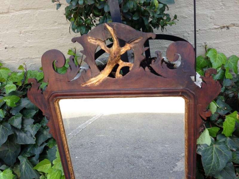 A Georgian mahogany mirror with an eagle